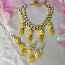 Load image into Gallery viewer, Gold and yellow jewelry set on a white background with pink ribbons.