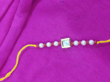 Load image into Gallery viewer, Elegant Kundan And Pearl Rakhi (Set of 4 Rakhi)